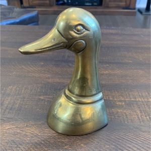 Brass duck head book stop